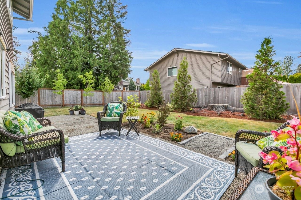 17043 159th Place Southeast Renton, WA 98058 - Photo 4 of 30 a view of an house with backyard and sitting area