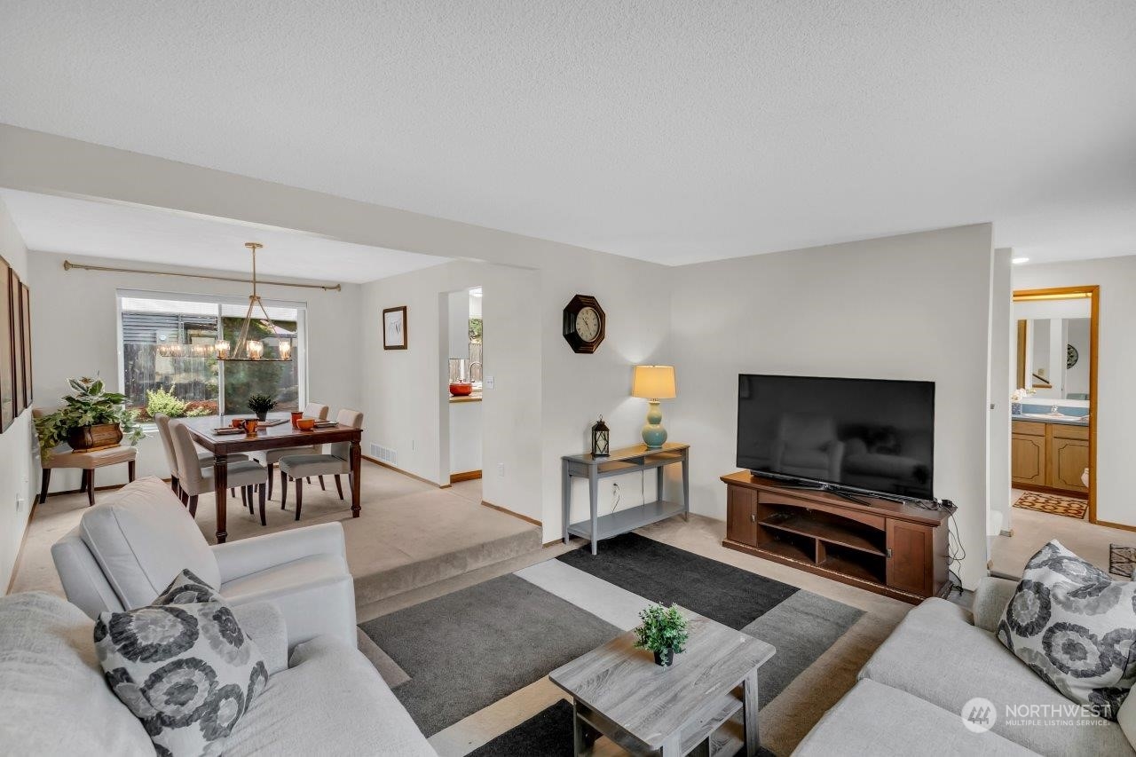17043 159th Place Southeast Renton, WA 98058 - Photo 5 of 30 a living room with furniture and a flat screen tv