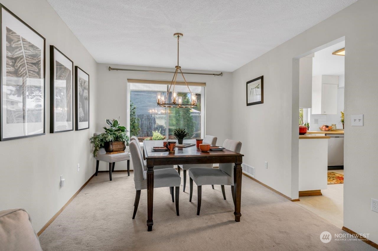 17043 159th Place Southeast Renton, WA 98058 - Photo 8 of 30 a view of a dining room with furniture window and outside view