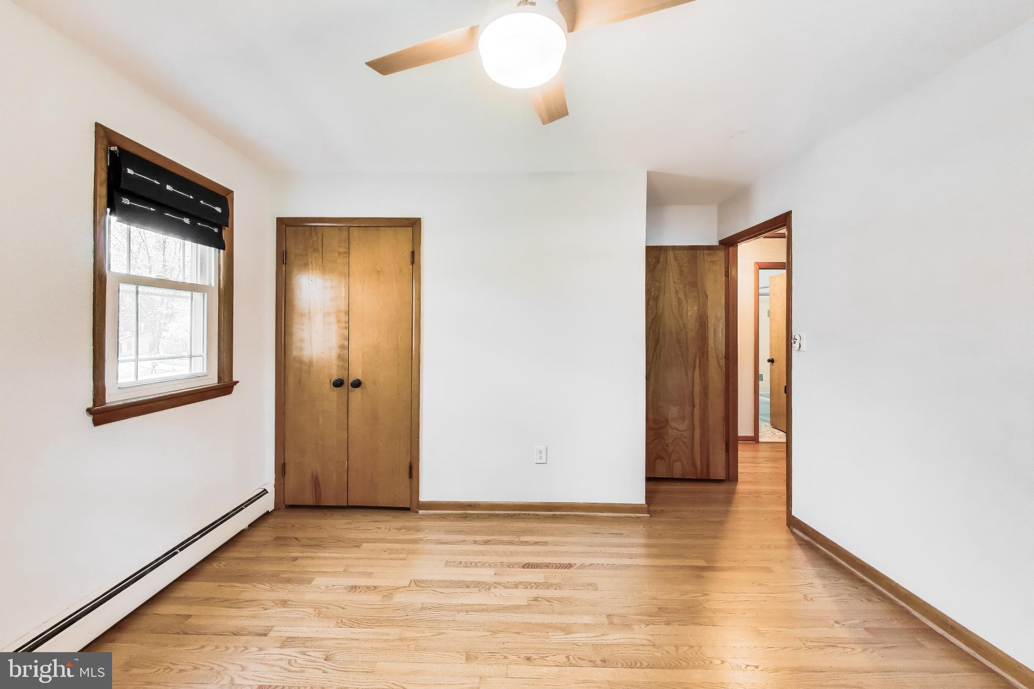 3904 Overlook Lane Monrovia, MD 21770 - Photo 23 of 54 a view of an empty room with window and wooden floor
