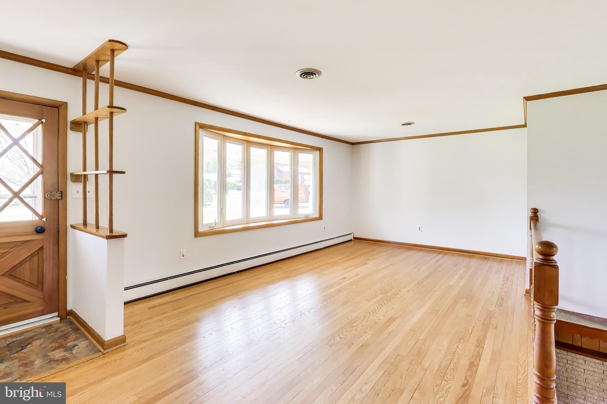 3904 Overlook Lane Monrovia, MD 21770 - Photo 6 of 54 a view of an empty room with wooden floor and a window
