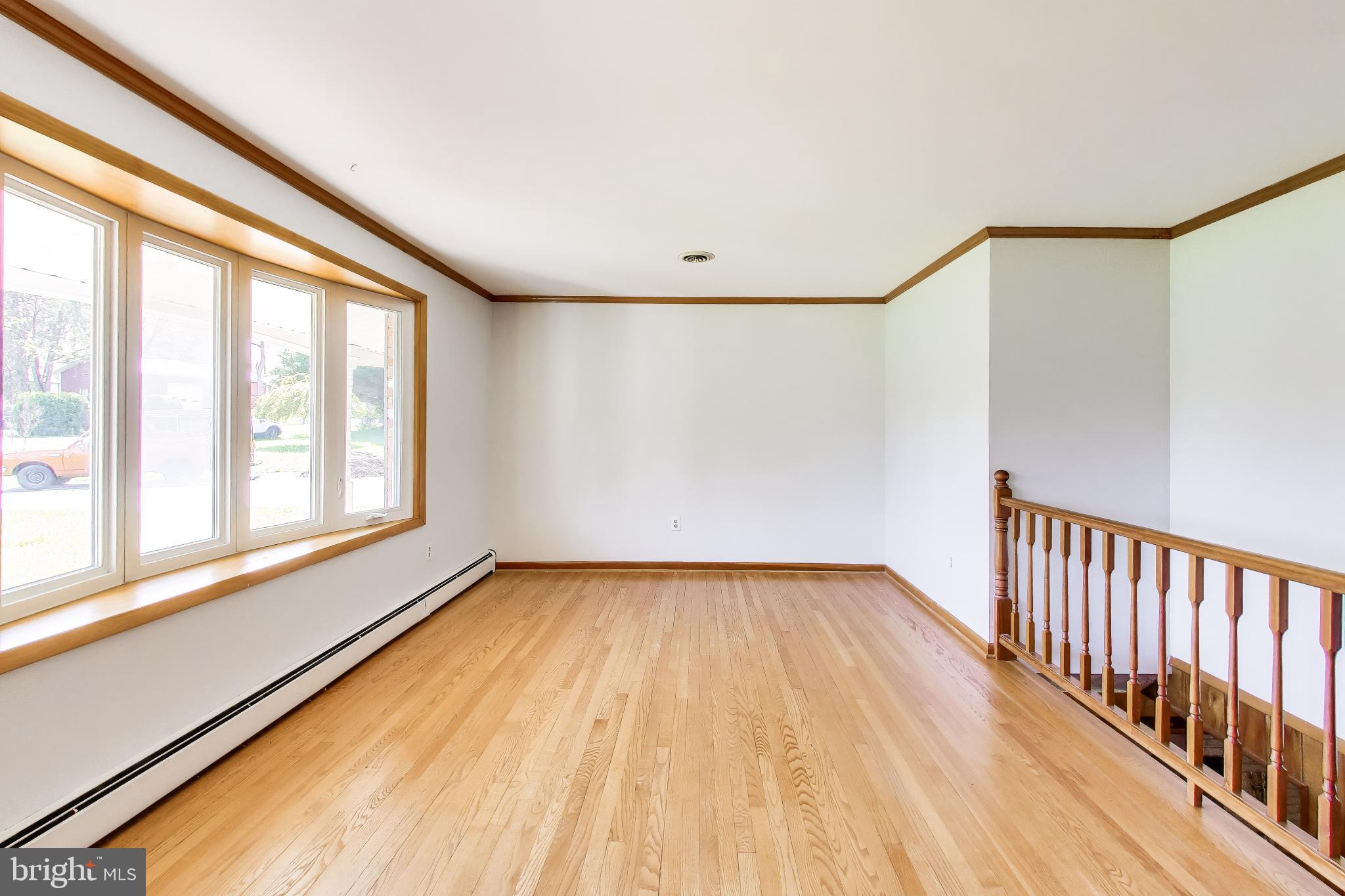 3904 Overlook Lane Monrovia, MD 21770 - Photo 7 of 54 a view of an empty room with wooden floor and a window