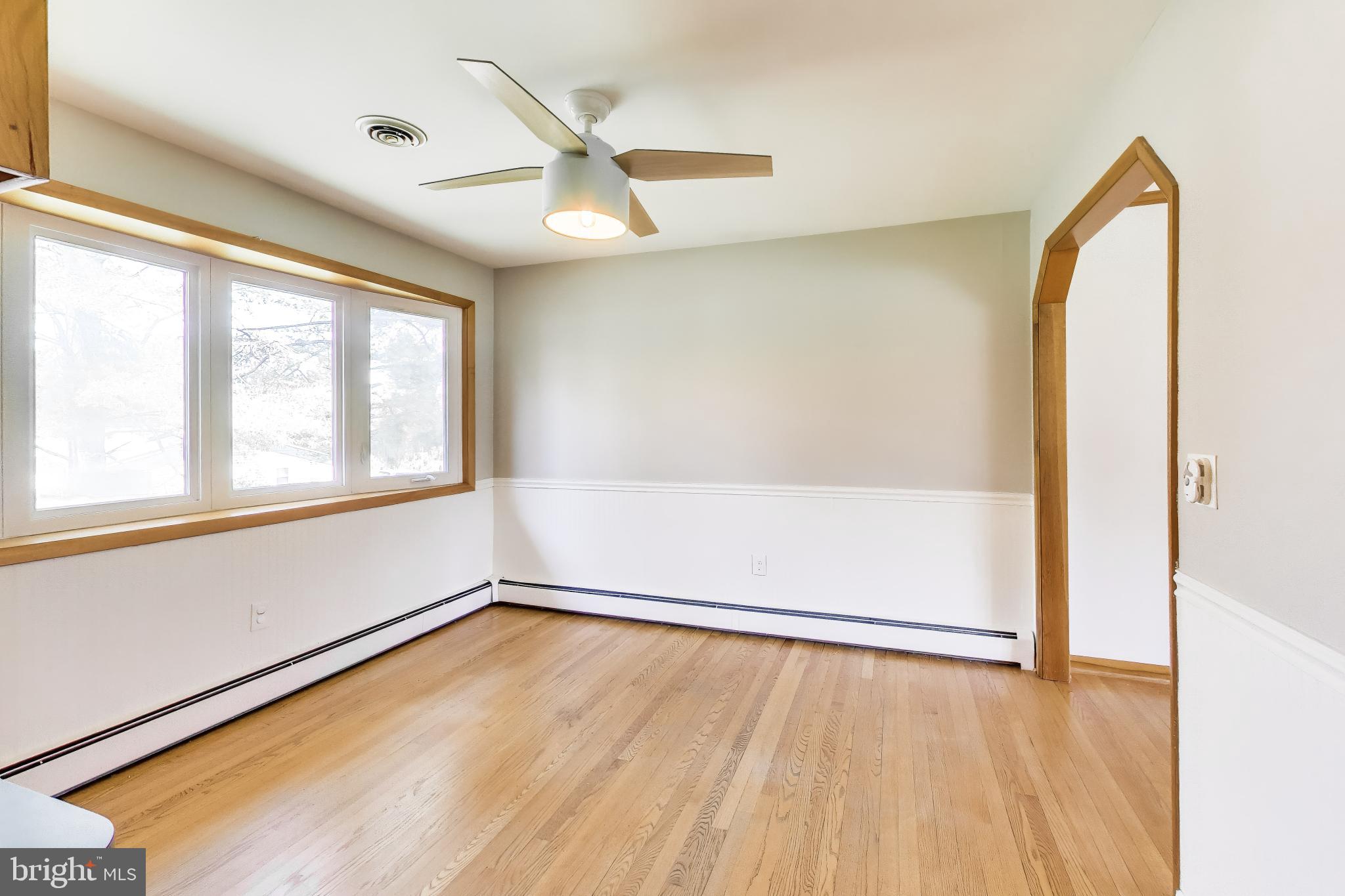 3904 Overlook Lane Monrovia, MD 21770 - Photo 10 of 54 an empty room with wooden floor and windows