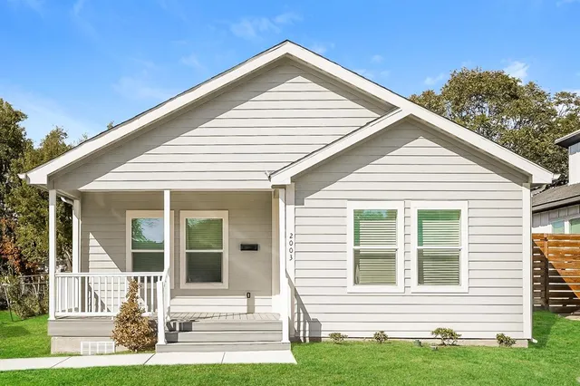 a front view of a house with yard
