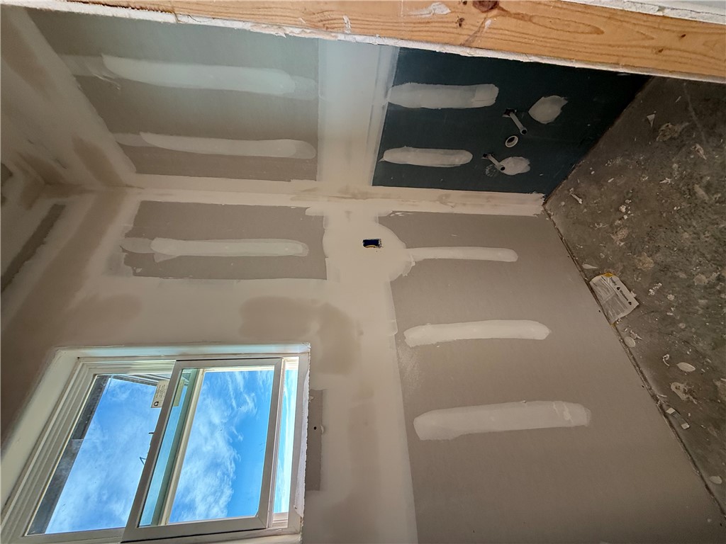 6423 Scenic View Trail Bryan, TX 77808 - Photo 14 of 43 a view of an empty room with a fireplace and a painting on the wall