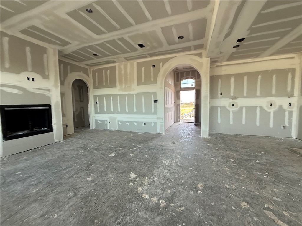 6423 Scenic View Trail Bryan, TX 77808 - Photo 18 of 43 a view of a big room with chandelier and fireplace