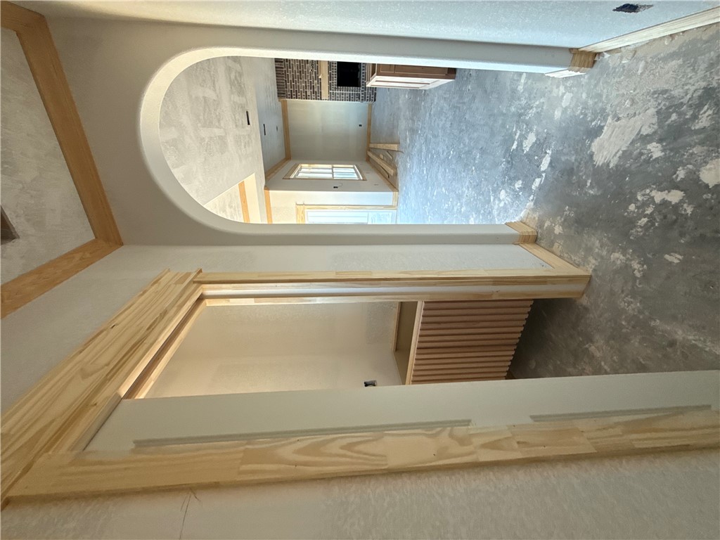 6423 Scenic View Trail Bryan, TX 77808 - Photo 32 of 43 a view of a hallway with wooden shelves