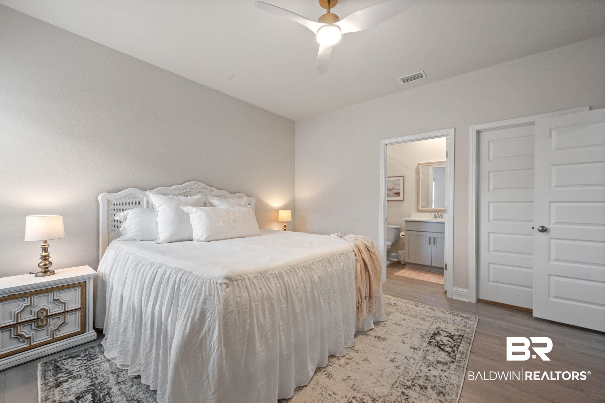 681 Calibre Street Fairhope, AL 36532 - Photo 43 of 56 Bedroom with light hardwood / wood-style flooring, connected bathroom, and ceiling fan