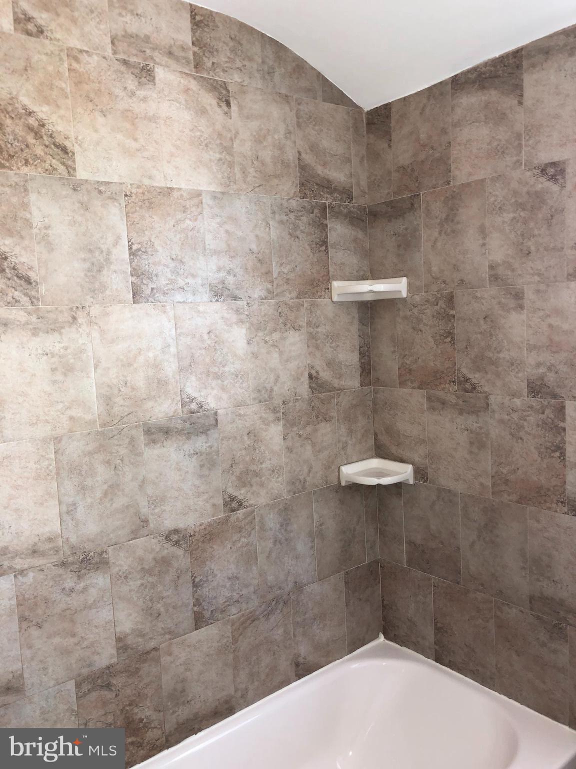2005 Ramblewood Road Baltimore, MD 21239 - Photo 14 of 19 Updated full bathroom with ceramic backsplash
