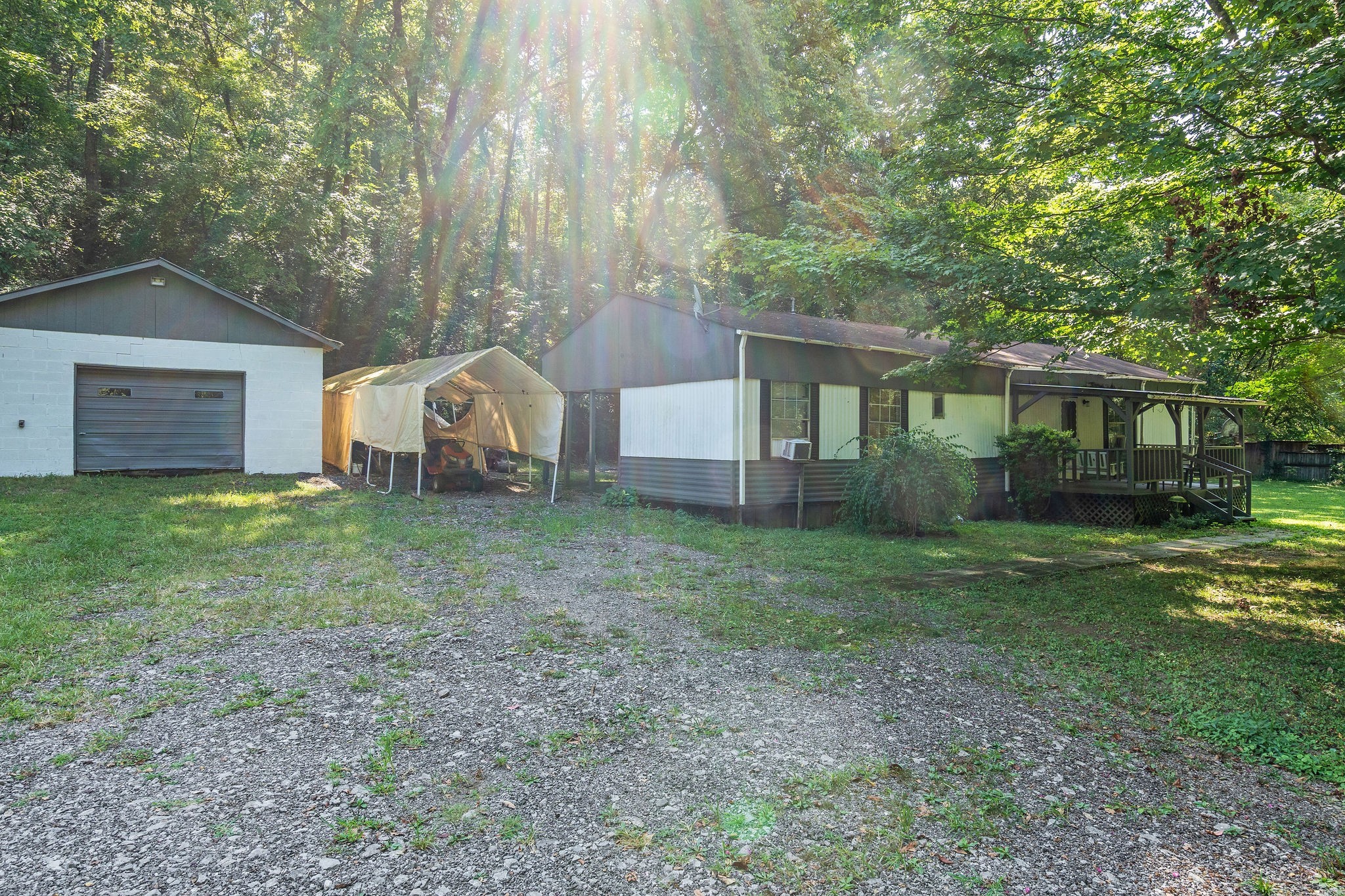 1046 Cemetery Road Ashland City, TN 37015 - Photo 5 of 15 a view of a house with backyard and a tree