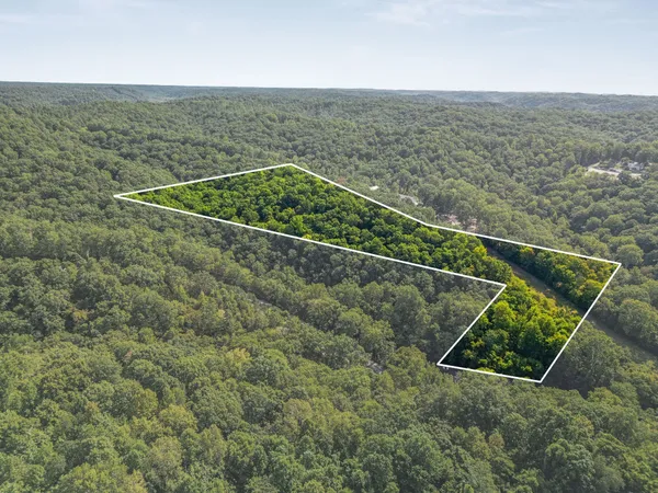 an aerial view of houses with yard