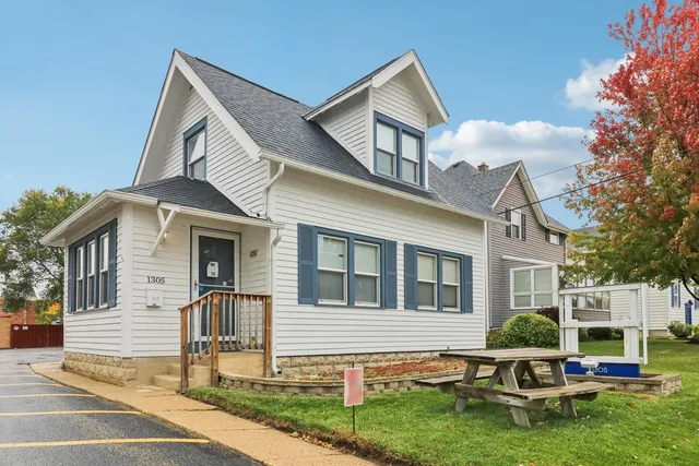 a house view with a seating space and garden