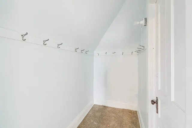 a bathroom with a shower curtain and a window