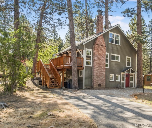 195 Elgin Road Big Bear Lake, CA 92315 - Photo 1 of 45 a front view of a house with a yard
