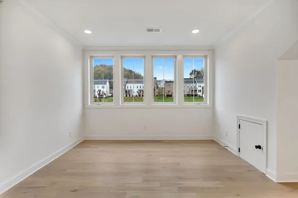 wooden floor and window in an empty room