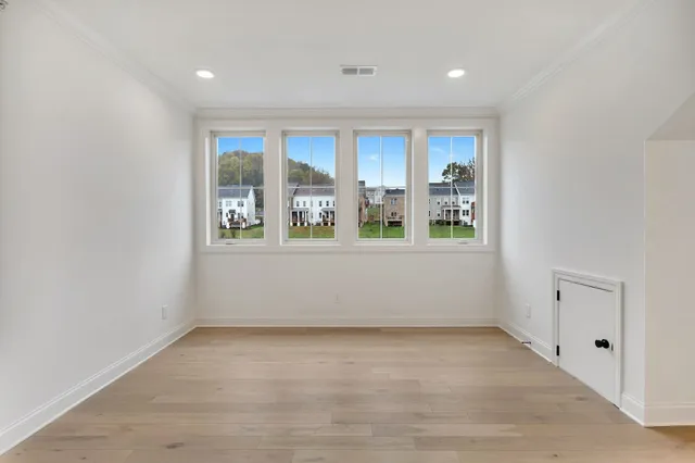 wooden floor and window in an empty room