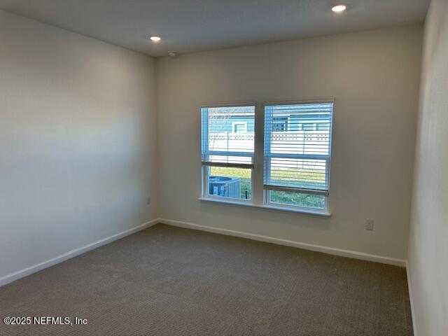 156 Camphor Laurel Road St. Augustine, FL 32092 - Photo 8 of 34 an empty room with a window