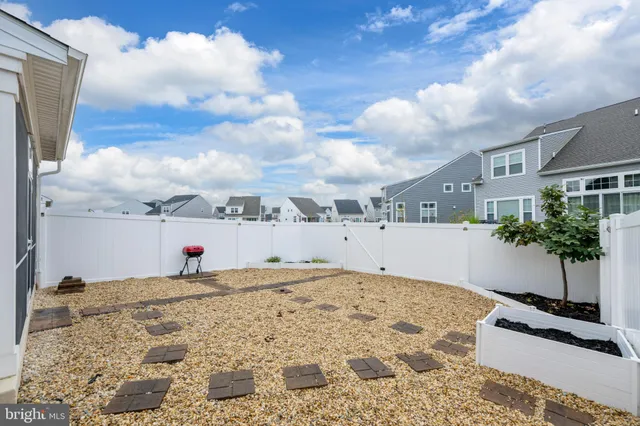 a view of an ocean and houses with outdoor space