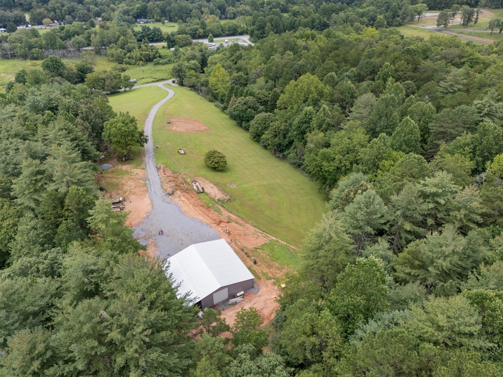 115 Ash Loop Road Hayesville, NC 28904 - Photo 4 of 37 an aerial view of a house with a yard and trees all around