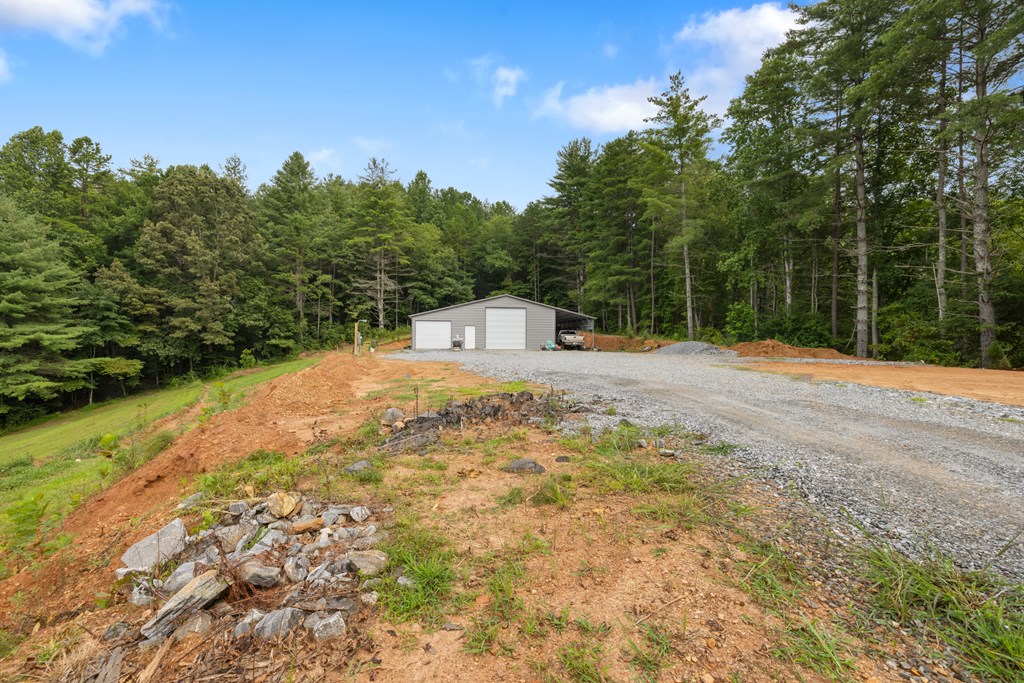 115 Ash Loop Road Hayesville, NC 28904 - Photo 6 of 37 a backyard of a house with large trees