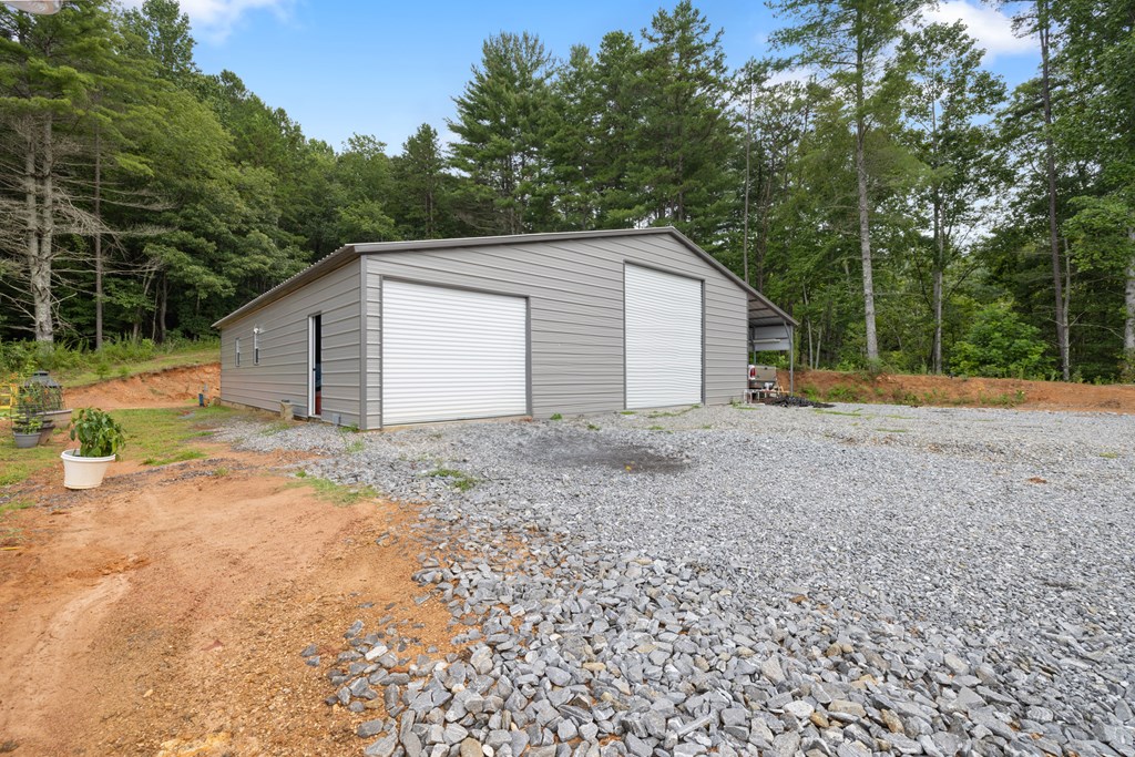 115 Ash Loop Road Hayesville, NC 28904 - Photo 7 of 37 a view of backyard of house and trees