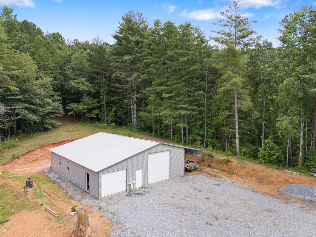 115 Ash Loop Road Hayesville, NC 28904 - Photo 10 of 37 a view of a house with a backyard and trees