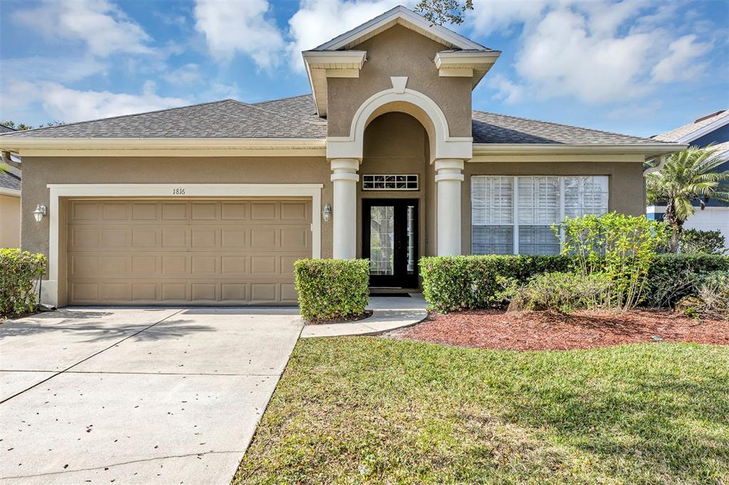 1816 Cherry Ridge Drive Lake Mary, FL 32746 - Photo 1 of 64 a front view of a house with garden
