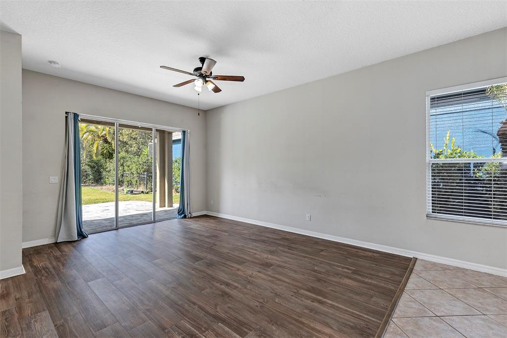 1816 Cherry Ridge Drive Lake Mary, FL 32746 - Photo 13 of 64 a view of an empty room with wooden floor and a window