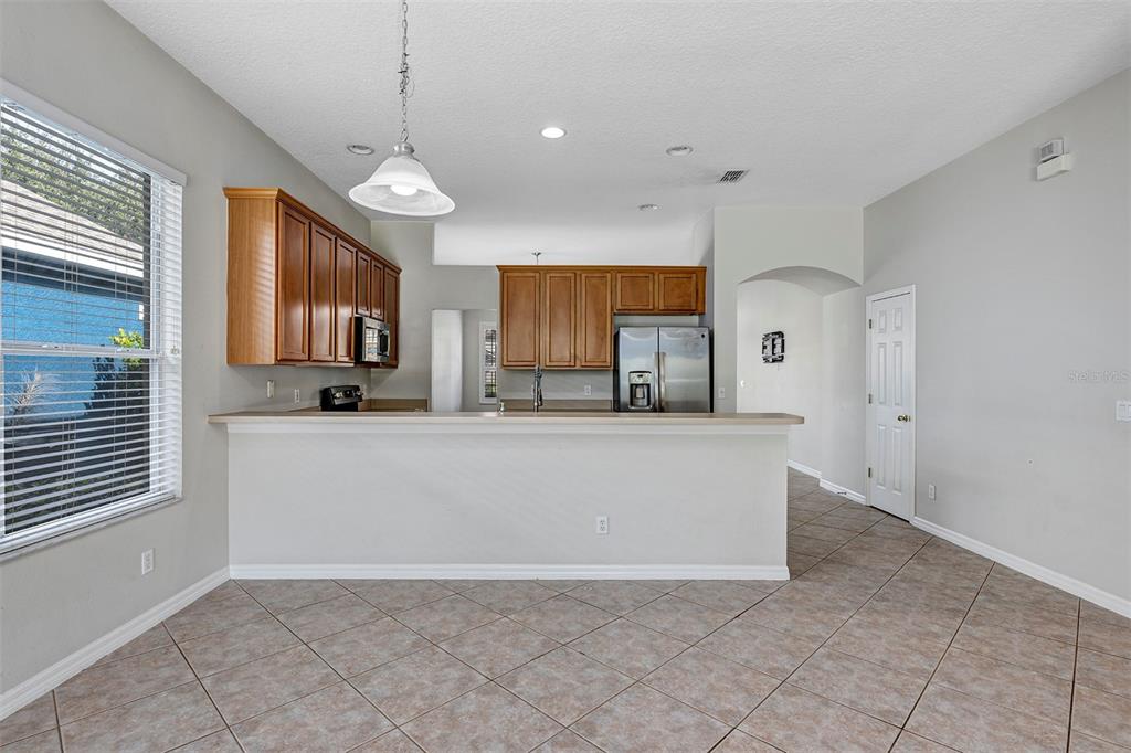 1816 Cherry Ridge Drive Lake Mary, FL 32746 - Photo 15 of 64 a view of living room with granite countertop furniture and fireplace