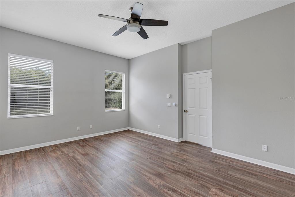 1816 Cherry Ridge Drive Lake Mary, FL 32746 - Photo 20 of 64 a view of empty room with wooden floor and fan