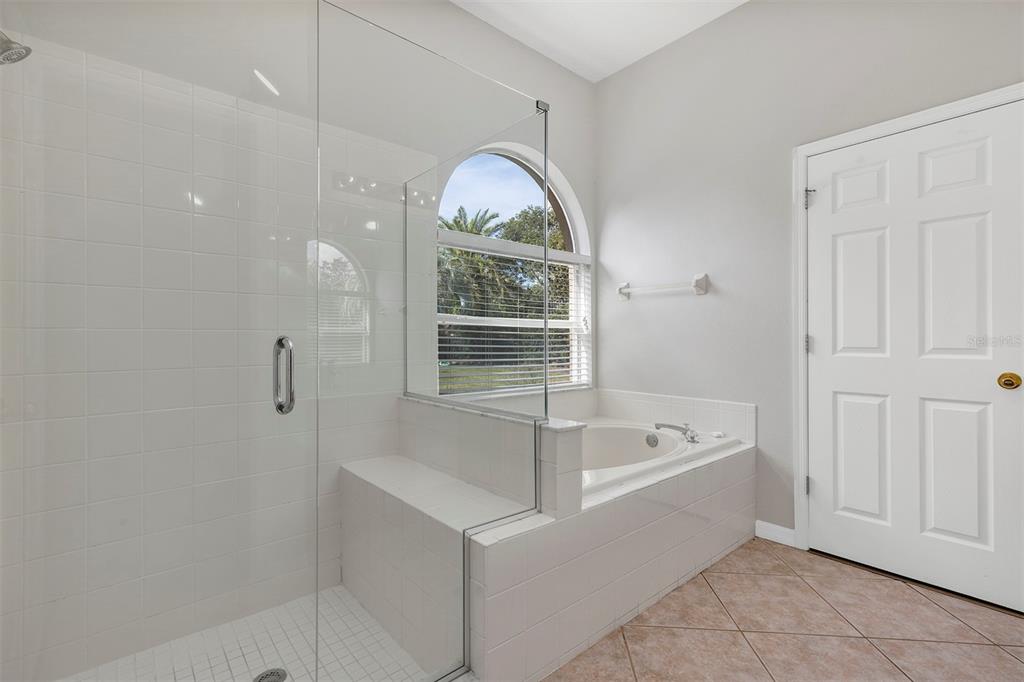 1816 Cherry Ridge Drive Lake Mary, FL 32746 - Photo 25 of 64 a bathroom with a tub a sink and a window