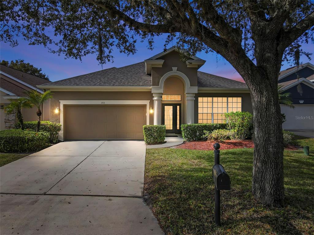 1816 Cherry Ridge Drive Lake Mary, FL 32746 - Photo 6 of 64 a front view of a house with garden