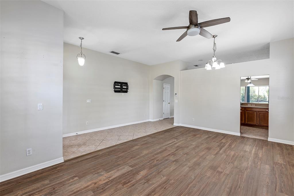 1816 Cherry Ridge Drive Lake Mary, FL 32746 - Photo 10 of 64 an empty room with wooden floor and ceiling fan