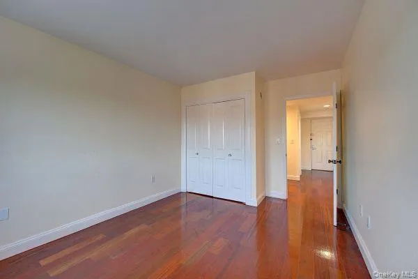 a view of wooden floor in an empty room