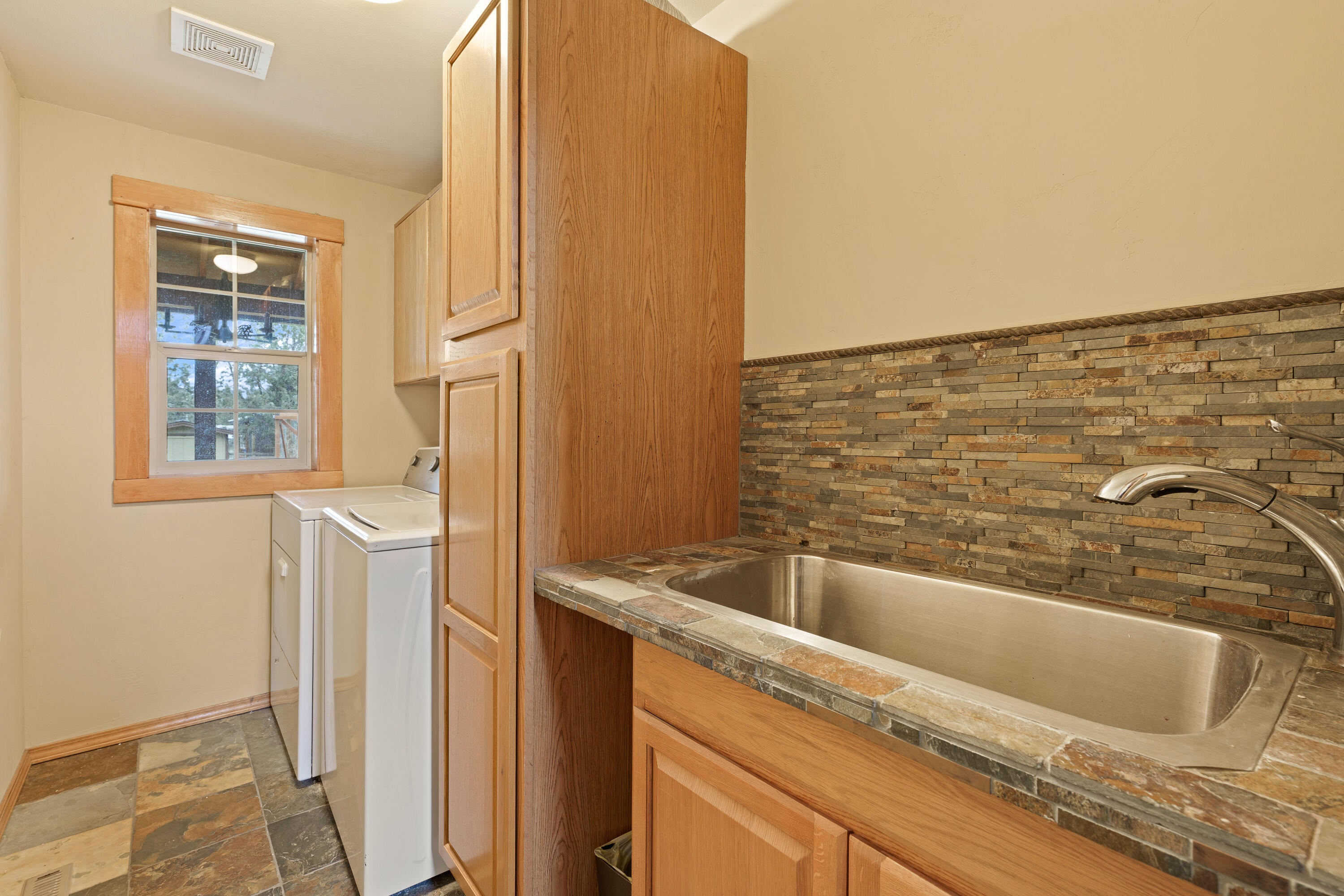 5871 Southwest Badger Road Terrebonne, OR 97760 - Photo 22 of 50 Laundry Room with storage and sink
