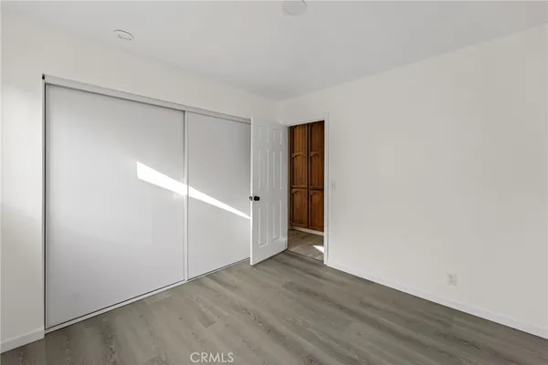 an empty room with wooden floor