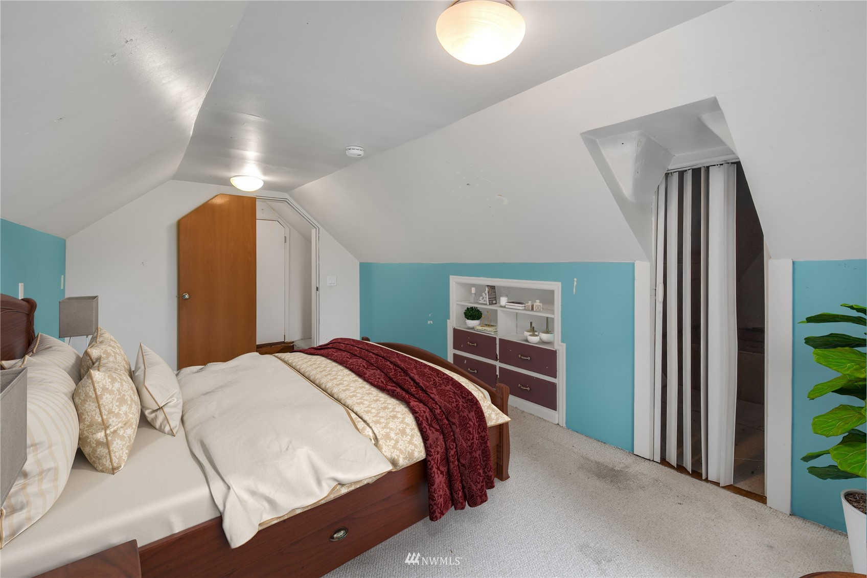 6422 Cady Road Everett, WA 98203 - Photo 11 of 21 a bedroom with a bed and a chandelier