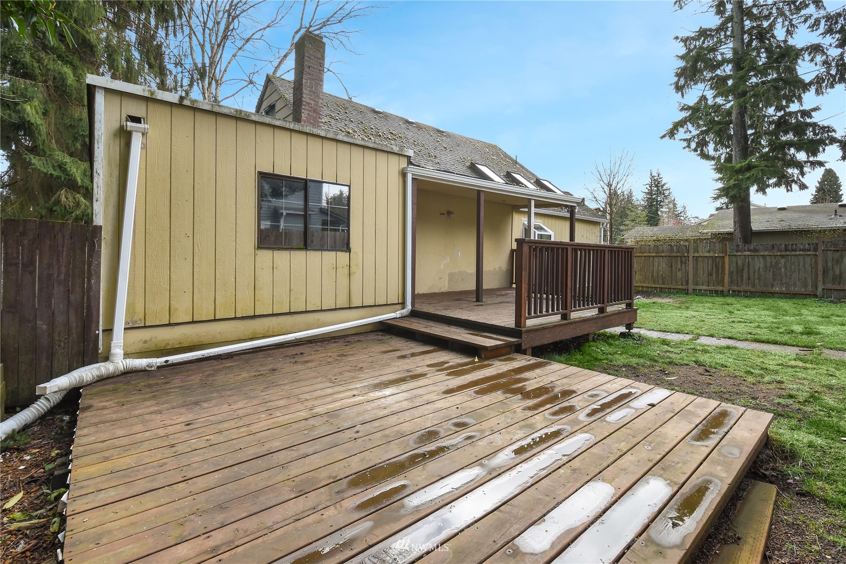 6422 Cady Road Everett, WA 98203 - Photo 17 of 21 a view of a house with backyard and wooden fence