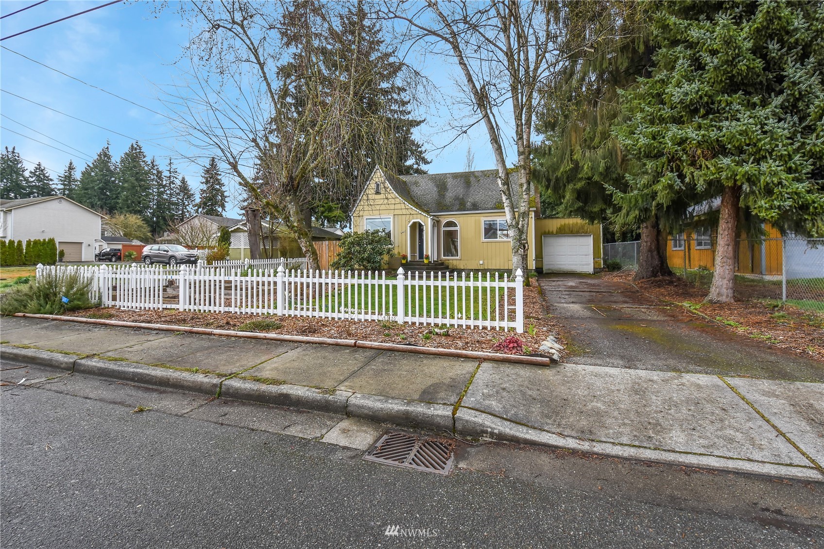 6422 Cady Road Everett, WA 98203 - Photo 20 of 21 a view of a house with a fence and a trees