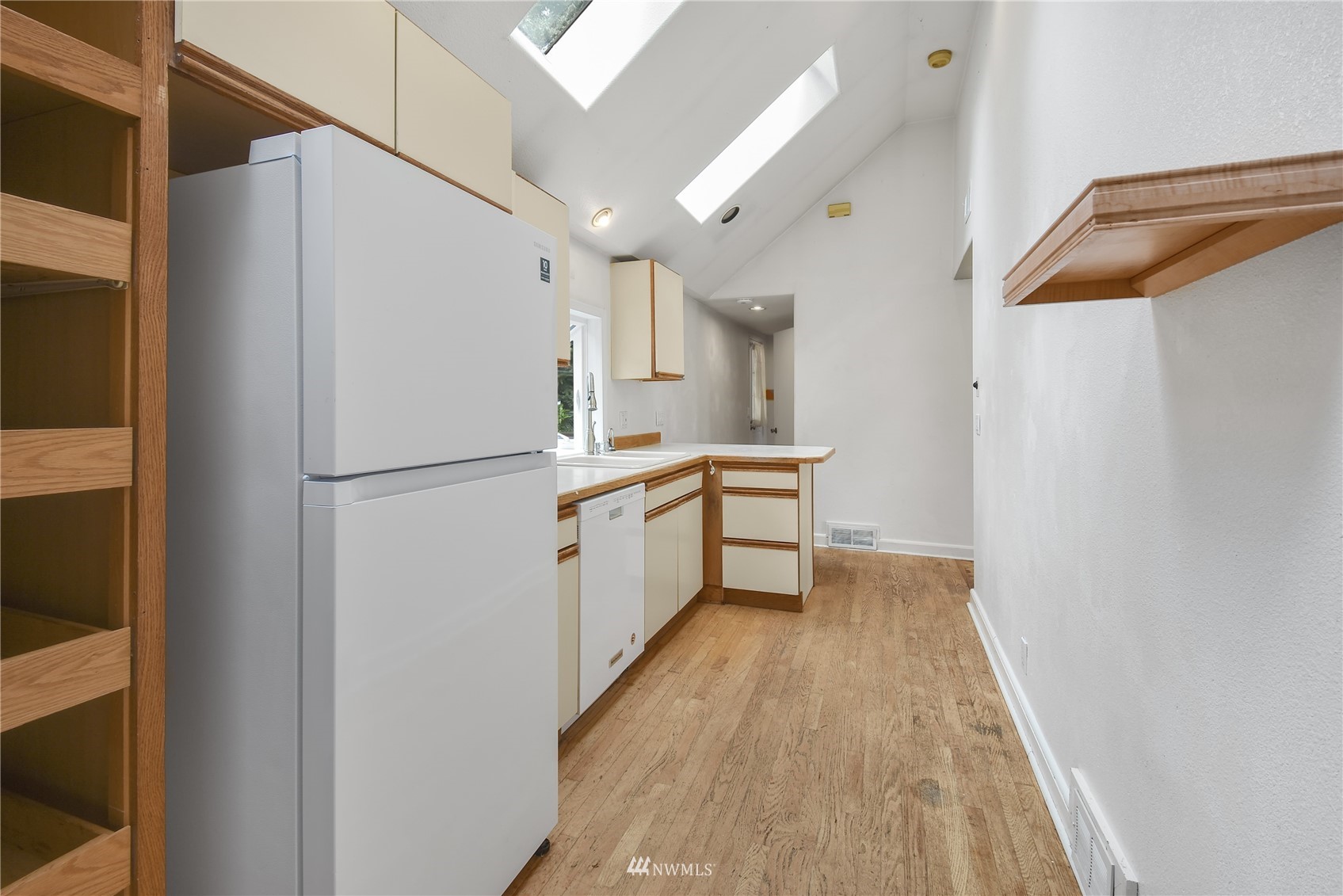6422 Cady Road Everett, WA 98203 - Photo 9 of 21 a kitchen with a refrigerator a sink and dishwasher