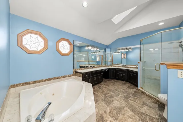 a bathroom with a bathtub and a shower