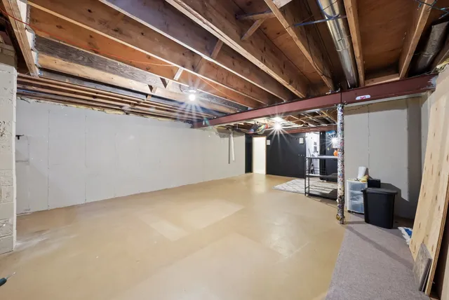 a view of a room with wooden walls