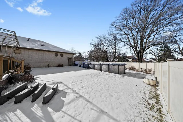 a view of house with a yard and ocean view