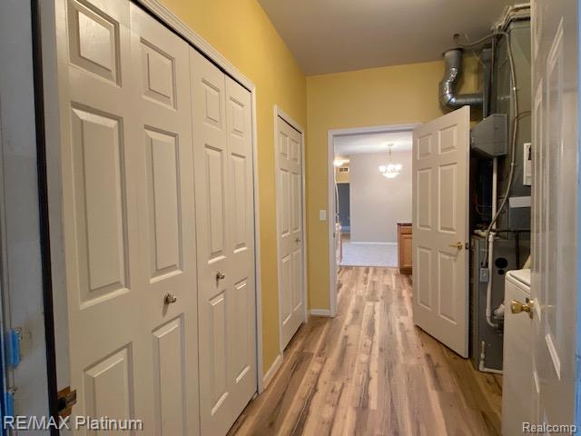 1105 Rial Lake Drive, Unit 45 Howell, MI 48843 - Photo 11 of 19 Laundry features new vinyl plank flooring, huge pantry, plus coat closet.
