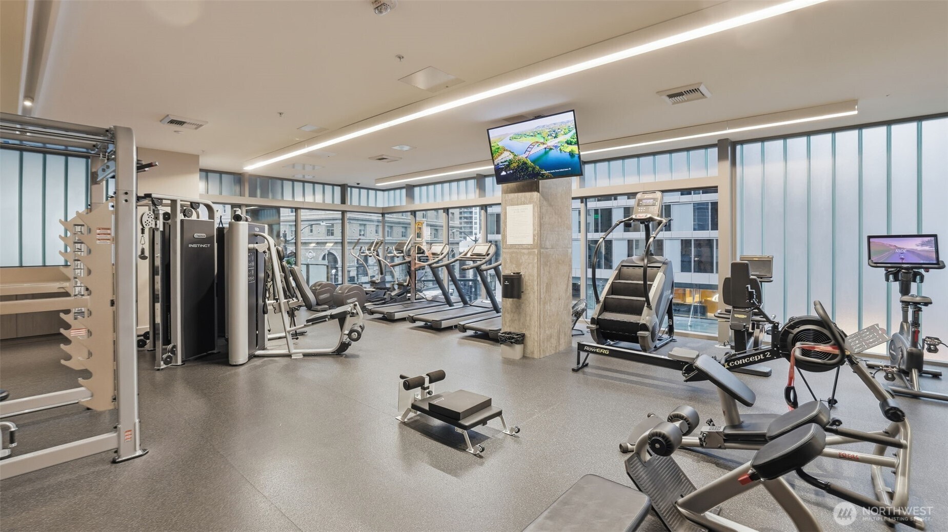 121 Stewart Street, Unit 905 Seattle, WA 98101 - Photo 23 of 37 a view of a room with gym equipment