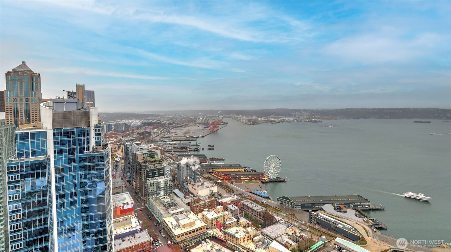 121 Stewart Street, Unit 905 Seattle, WA 98101 - Photo 31 of 37 a view of a city with tall buildings