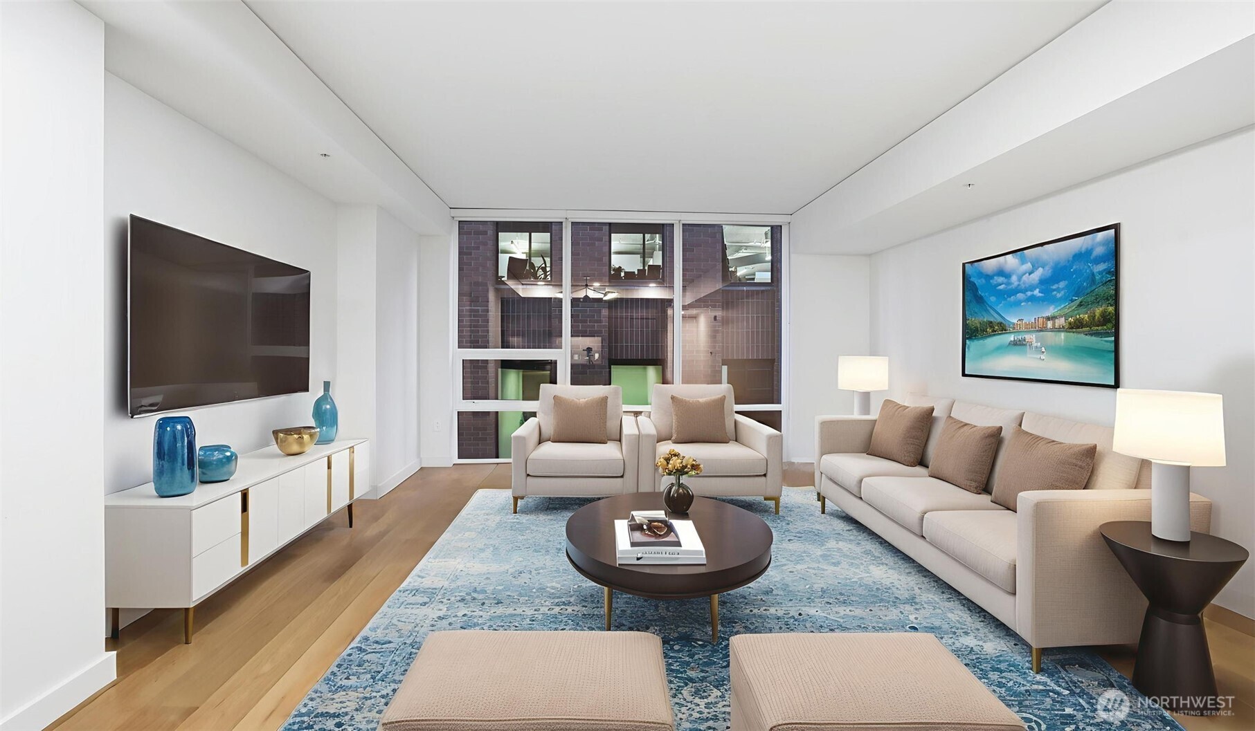 121 Stewart Street, Unit 905 Seattle, WA 98101 - Photo 34 of 37 a living room with furniture and a flat screen tv