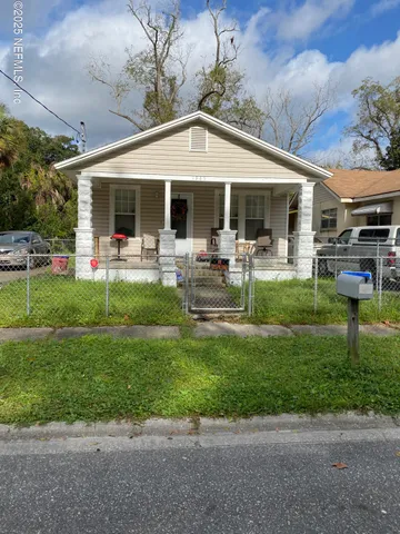a front view of house with yard patio and green space