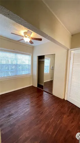 a view of room with window and wooden floor
