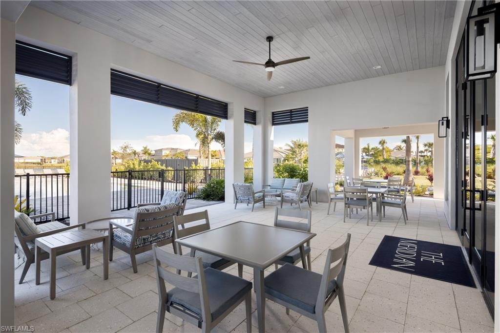 8775 Oceana Way Naples, FL 34114 - Photo 19 of 30 a view of a dining room with furniture window and outside view
